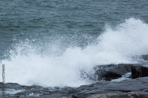 Waves of Lake Superior crashing on rocky shore