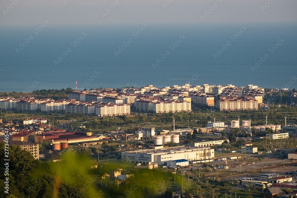 Houses near the sea. City block. Construction of houses in the resorts. No people. The view from the top. Evening light.