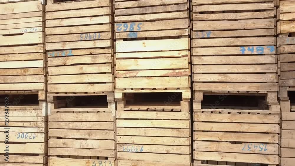 Aerial photography of a large number of wooden crates. Wooden containers for storing apples. Aerial photography of a large number of wooden crates. Wooden containers for storing apples.