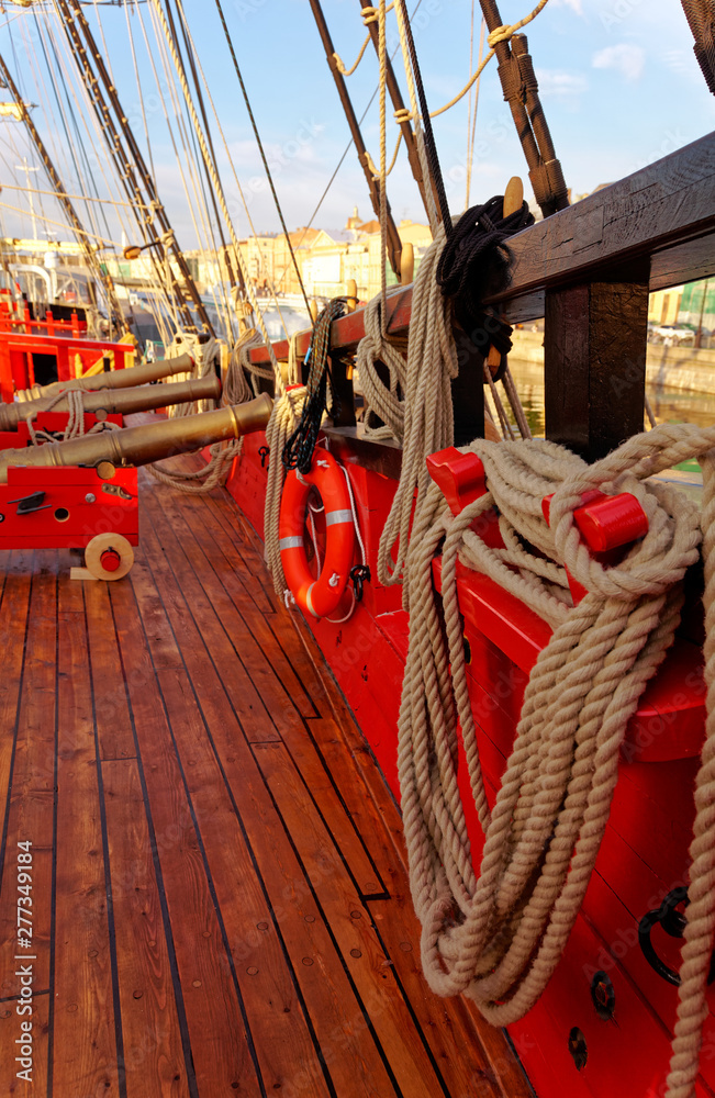 Masts and rigging of an old wooden sailboat. Details deck of the ship.