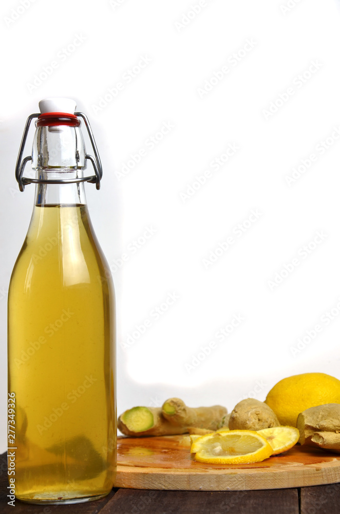 Homemade fermented raw kombucha tea with different flavorings. Healthy natural probiotic flavored drink with lemon and ginger or ginger ale. Copy space. Homemade fermented raw kombucha tea with different flavorings. Healthy natural probiotic flavored drink with lemon and ginger or ginger ale. Copy space.