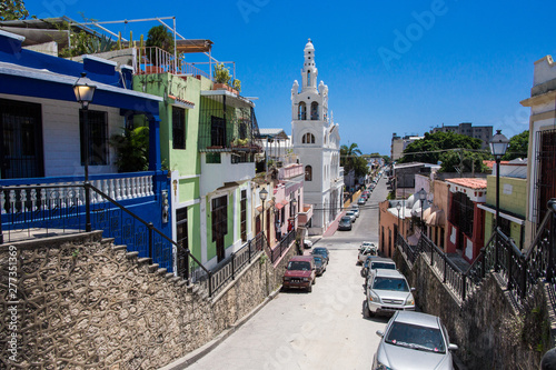 Hostos street, Santo Domingo, Dominican Republic. Beautiful street goes down in the colonial zone. view of Santuario Nuestra Señora de la Altagracia