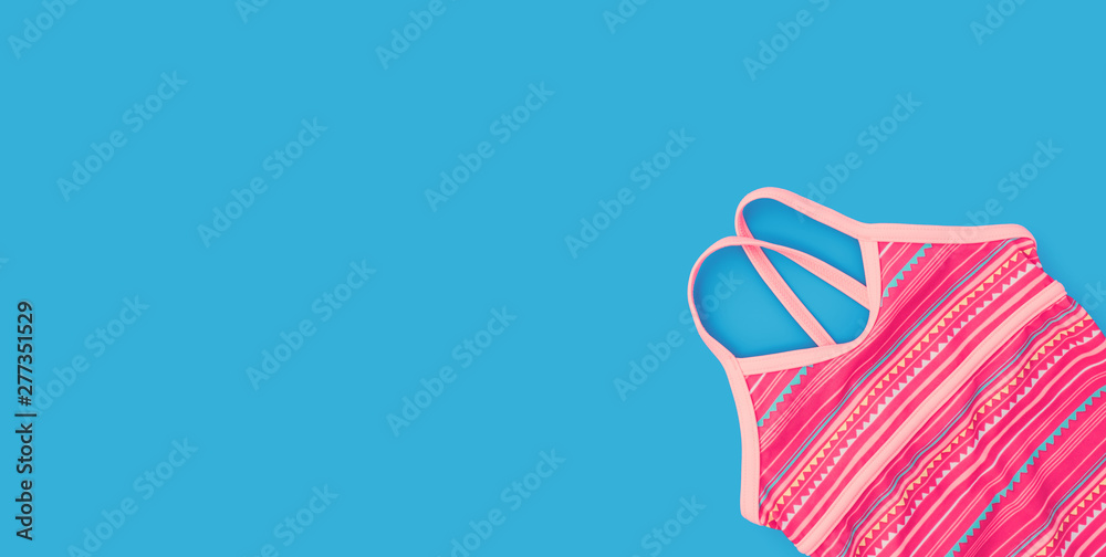 Swimsuit in trendy colors on a blue background. Swimsuit in trendy colors on a blue background.