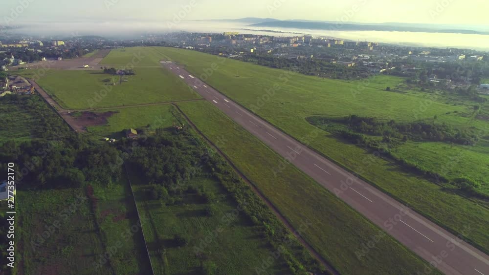 Aerial view of small aviation, located in close to town with amazing building and nature. 4K. Aerial view of small aviation, located in close to town with amazing building and nature. 4K.