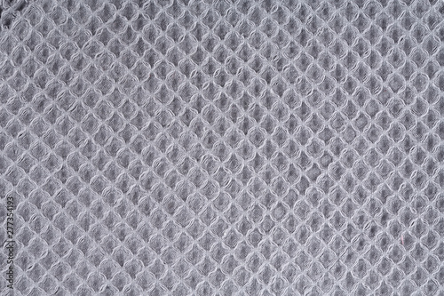 Gray corrugated cotton textile - close up of fabric texture. Cotton Fabric Texture. Gray Clothing Background. Text Space. Abstract background and texture for designers.