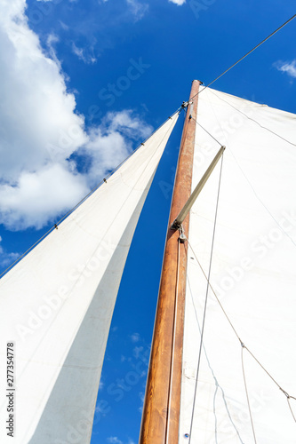 white sails against the sky