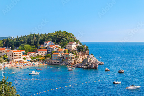 Picturesque summer view of Adriatic sea coast in Budva Riviera. Przno village with buildings on the rock, Montenegro © O.Farion