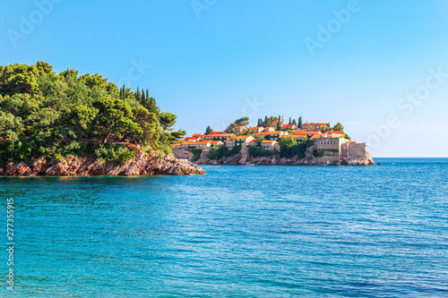 Fototapeta Naklejka Na Ścianę i Meble -  Picturesque summer view of Adriatic sea coast and Sveti Stefan island in Montenegro. Summer tropical seascape and amazing spot to visiting in Europe
