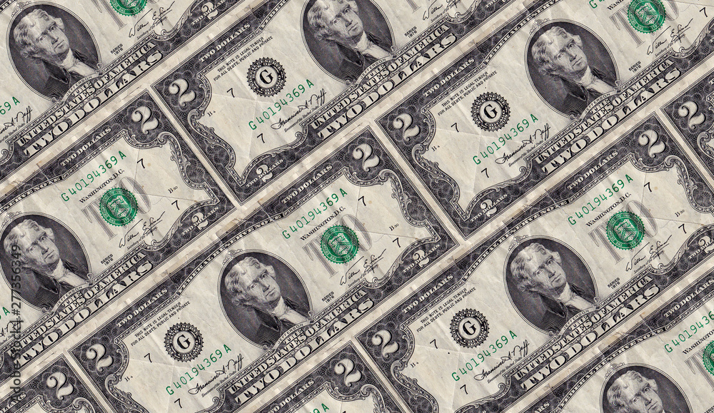 Old rumpled two dollar notes are decomposed diagonally Old rumpled two dollar notes are decomposed diagonally