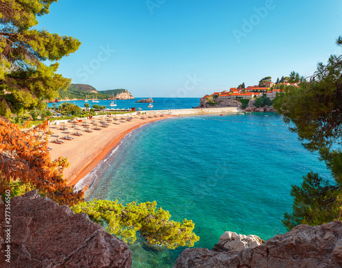 Picturesque summer view to the Sveti Stefan island with private beach, luxury resort on the Adriatic sea coast in Montenegro