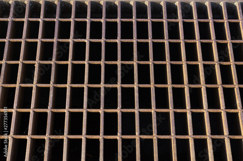 Rusted steel grid grate background pattern, horizontal aspect