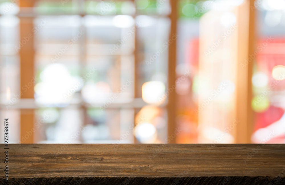Empty of wood table top on blur of curtain with window view green from tree garden background.For montage product display or design key visual layout Empty of wood table top on blur of curtain with window view green from tree garden background.For montage product display or design key visual layout
