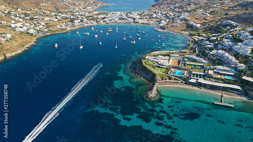 Aerial drone photo of paradise celebrity bay of Ornos famous for pool resorts and sandy turquoise organised clear sea beach, Mykonos island, Cyclades, Greece © aerial-drone