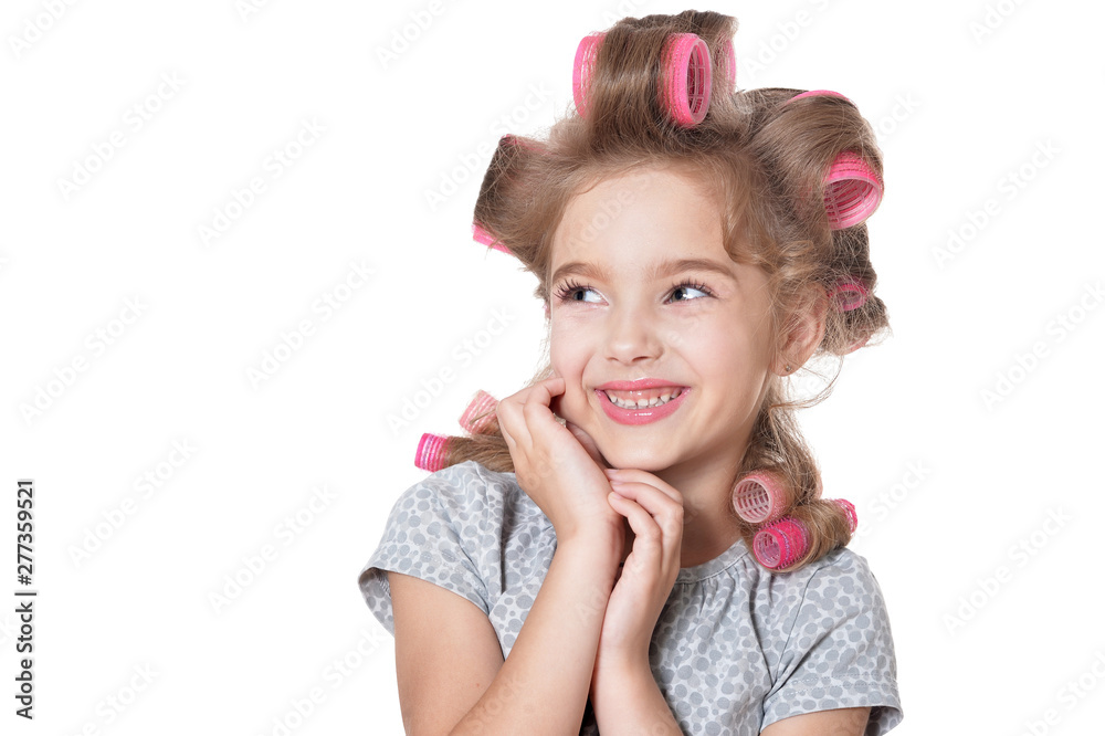 Portrait of emotional little pretty girl with hair curlers posing isolated Portrait of emotional little pretty girl with hair curlers posing isolated