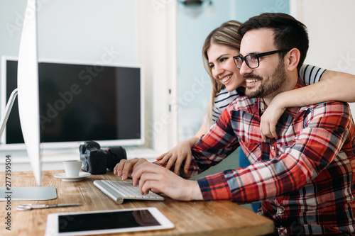 Young attractive designers working on project together