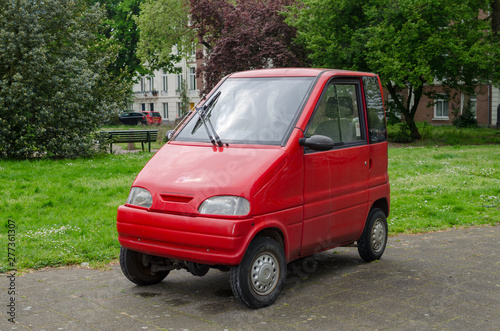 Amsterdam, Netherlands - May 03 2019: Small red car for two persons. Canta LX.