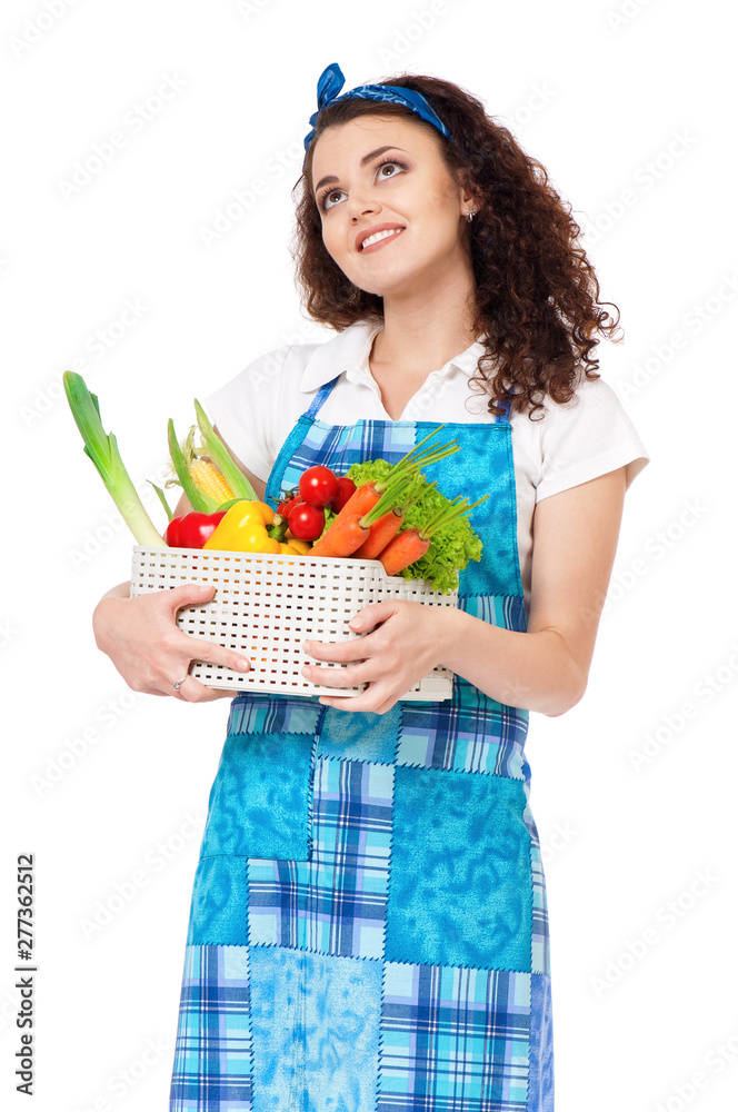 Young beautiful housewife with fresh vegetables, isolated on white background. Portrait of pretty woman with fresh vegetables. Studio shot. Young beautiful housewife with fresh vegetables, isolated on white background. Portrait of pretty woman with fresh vegetables. Studio shot.