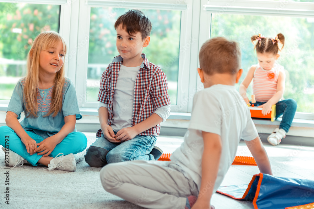 Nice pretty children sitting on the floor Nice pretty children sitting on the floor