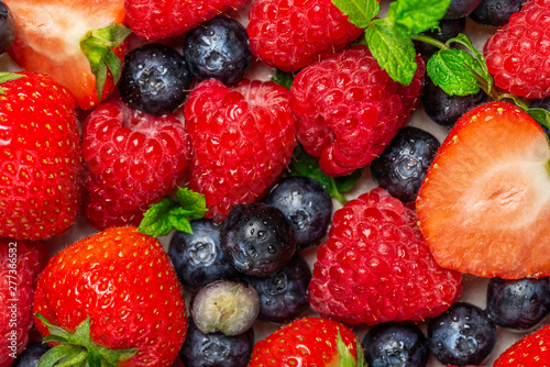 Fototapeta Naklejka Na Ścianę i Meble -  Fresh summer berries such as blueberries, strawberries, raspberries, top view