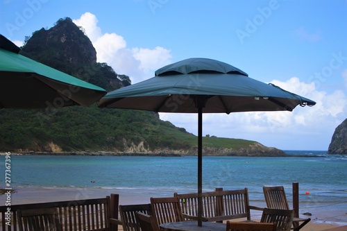 chairs and umbrella on tropical beach