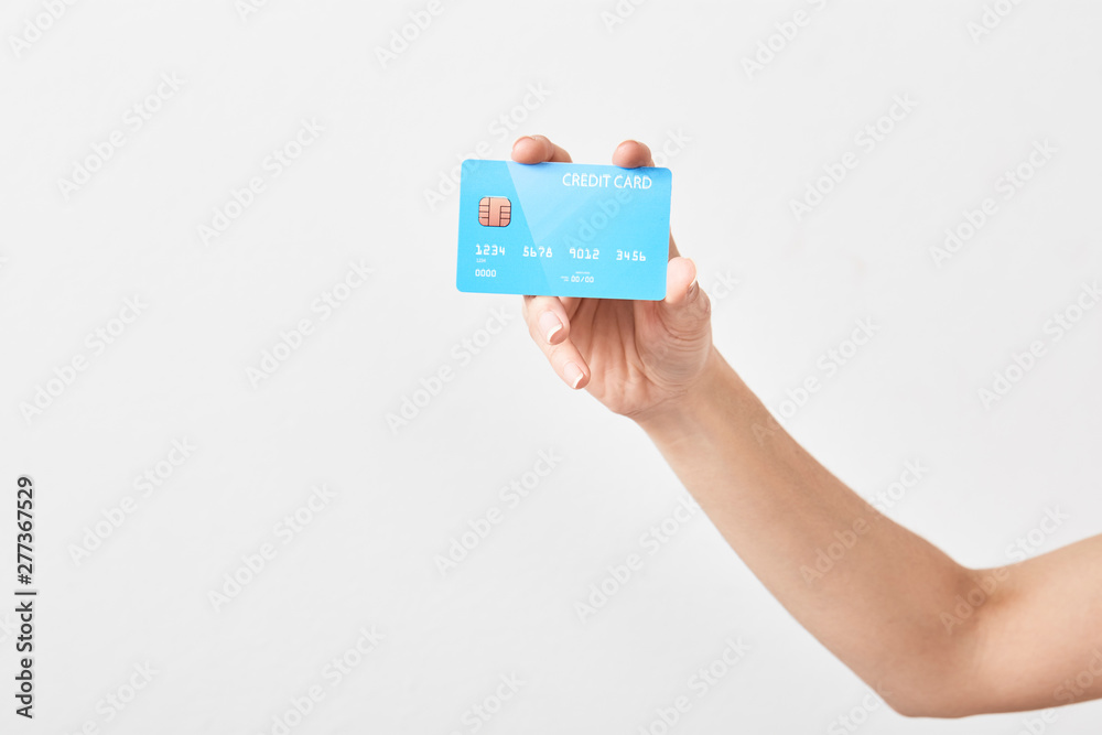 Credit card in hand on white Credit card in hand on white