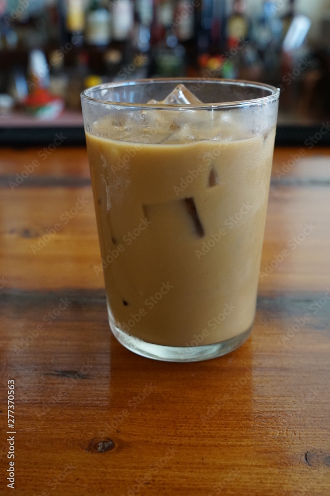 Glass of Iced Coffee with Milk on a Restaurant Bar Glass of Iced Coffee with Milk on a Restaurant Bar