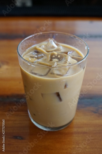 Glass of Iced Coffee with Milk on a Restaurant Bar