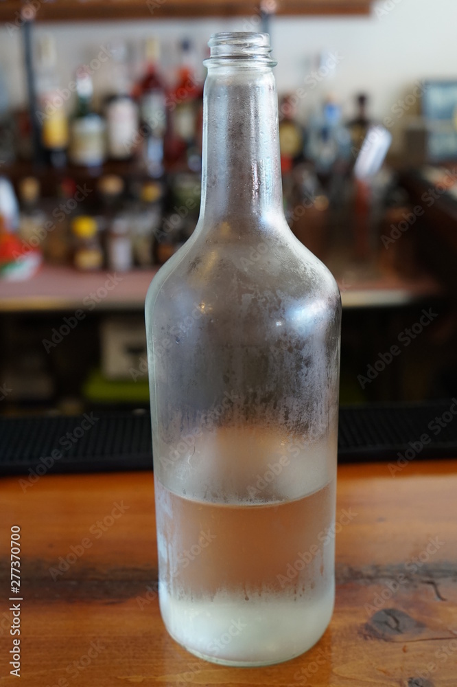 Cold Bottle of Water on Restaurant Bar