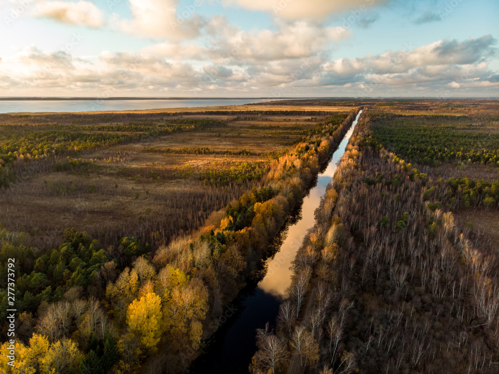 Naklejka premium Beautiful autumn aerial view of King Wilhelm’s Channel, that connects the river Minija and the Curonian Lagoon.