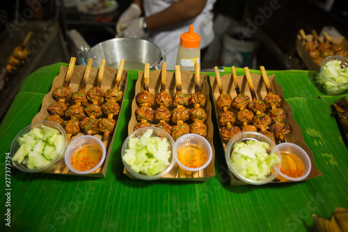 grilled spicy meat balls on a bamboo stick, Tahiland