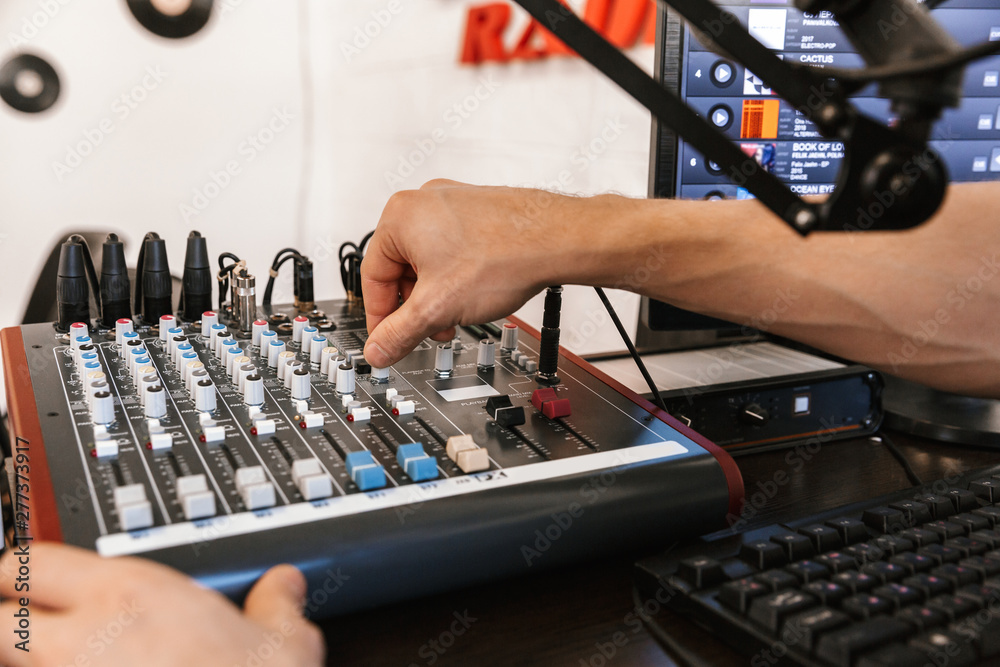 Close up of a male radio host broadcasting in studio Close up of a male radio host broadcasting in studio