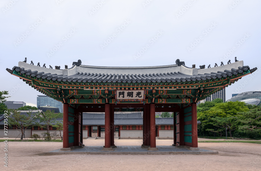 Naklejka premium Gwangmyeongmun Gate, once the south gate at Deoksugung Palace, a palace inhabited by members of Korea's royal family during the Joseon monarchy, located in Seoul.
