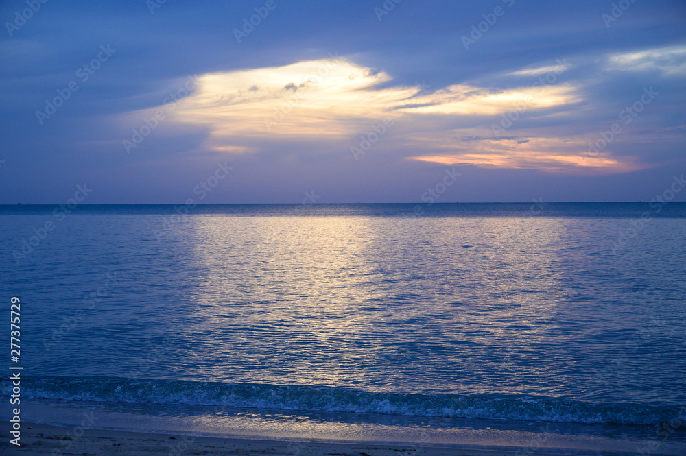 Landscape of sandy beach with soft wave and sunrise sky with cloud Landscape of sandy beach with soft wave and sunrise sky with cloud
