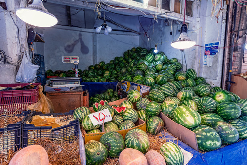 23/05/2019 Tabriz, Iran, East Azerbaijan Province, trading counter in the vegetable market with a lot of fresh watermelons photo