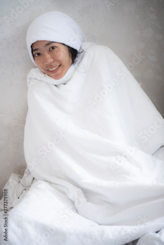 Cute girl covered with white towel