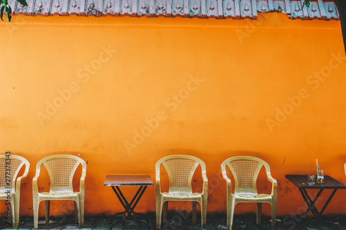 Outdoor cafe with chairs and table on the pavement in Ho Chi MInh city, Vietnam