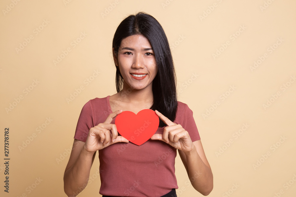 Asian woman with red heart. Asian woman with red heart.