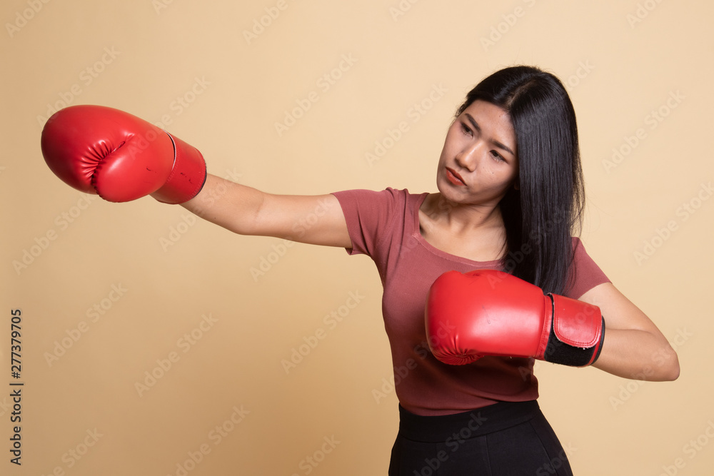 Young Asian woman with red boxing gloves. Young Asian woman with red boxing gloves.