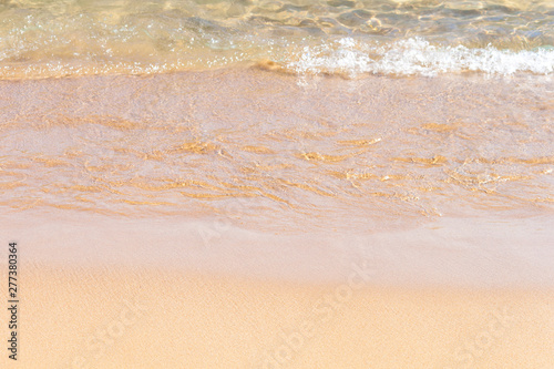 Fototapeta Naklejka Na Ścianę i Meble -  Clear soft wave of sea or ocean on sandy beach. Background.