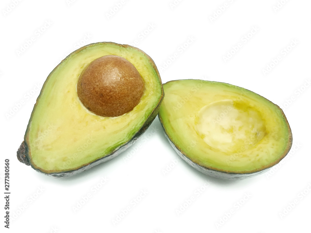 Whole and cut in half of avocado isolated on white background. Simple and delicious tasty recipes for everything from breakfast to dessert. Every meal of the day. For diet helps improve your overall.