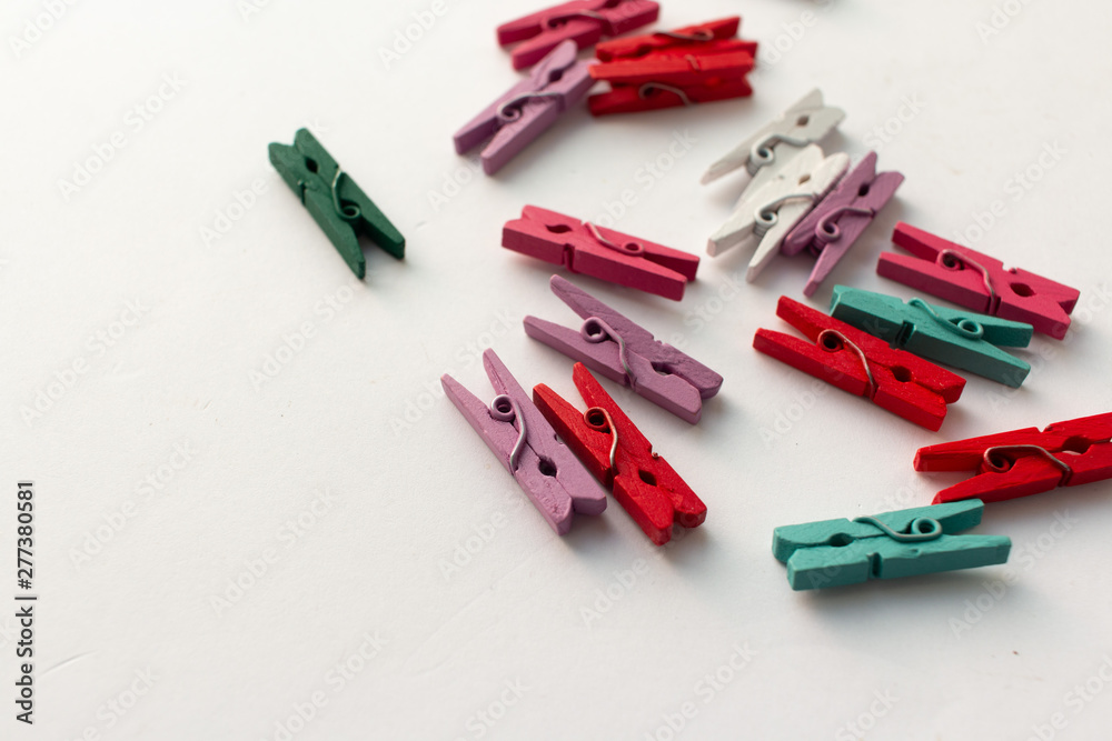 Pile of scattered clothes pegs isolated on white background Pile of scattered clothes pegs isolated on white background