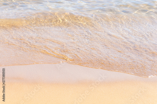 Fototapeta Naklejka Na Ścianę i Meble -  Clear soft wave of sea or ocean on sandy beach. Background.