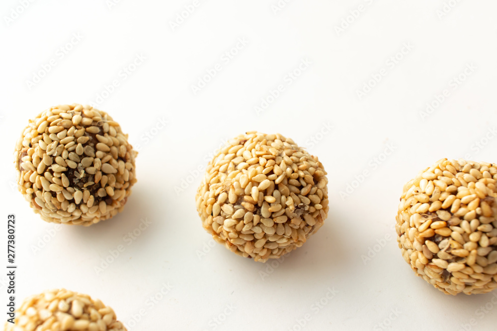Healthy homemade cookies with nuts and sesame on white background Healthy homemade cookies with nuts and sesame on white background