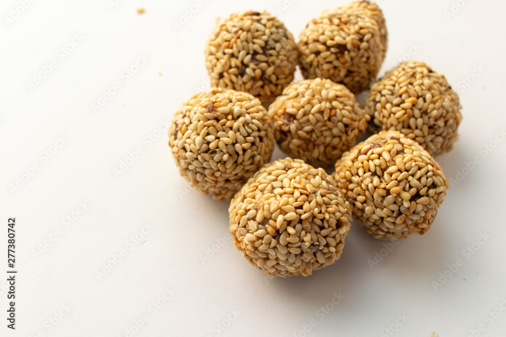 Healthy homemade cookies with nuts and sesame on white background Healthy homemade cookies with nuts and sesame on white background