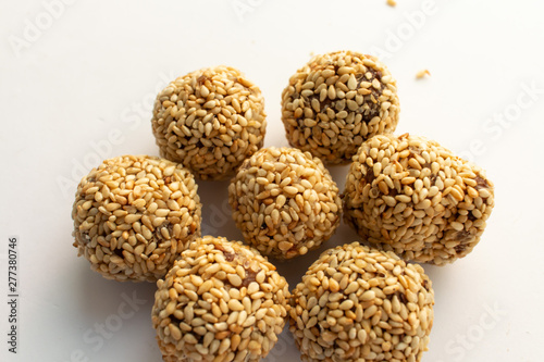 Healthy homemade cookies with nuts and sesame on white background