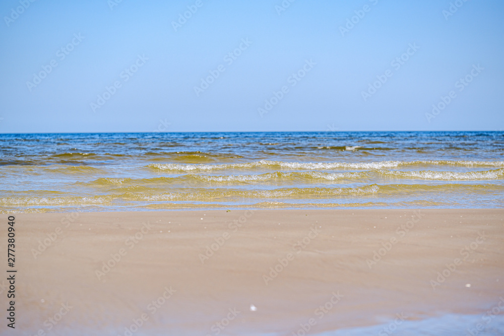 sea beach with blu sky and waves