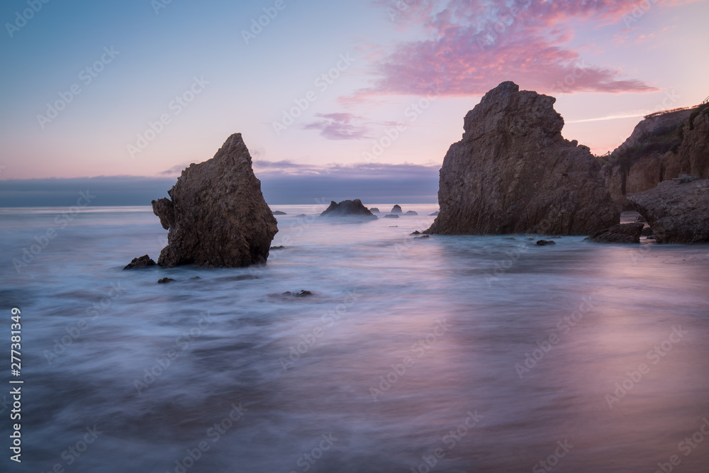 Beautiful and romantic El Matador State Beach in Malibu, Southern California, USA. Sunset in California - waves and sun hitting these beautiful rock formations.