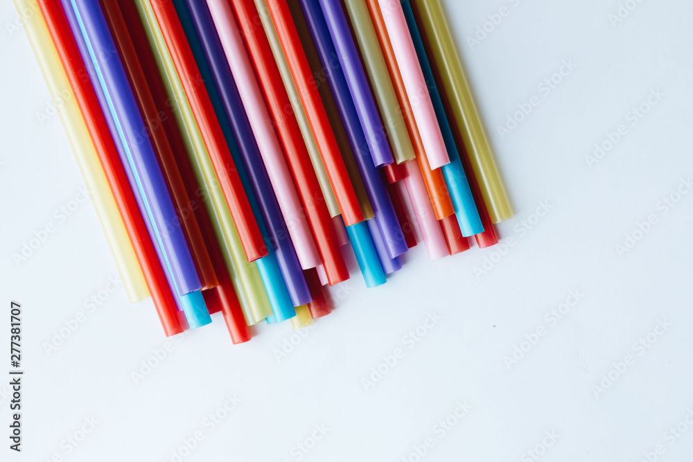 Pile of colorful cocktail straws over white background Pile of colorful cocktail straws over white background
