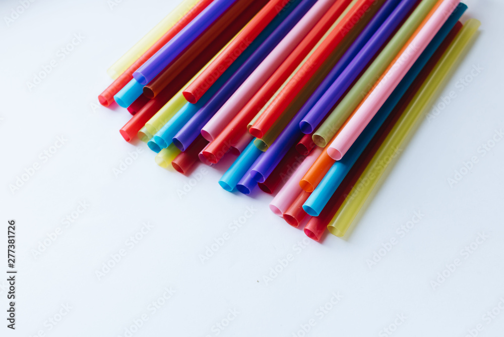 Pile of colorful cocktail straws over white background Pile of colorful cocktail straws over white background