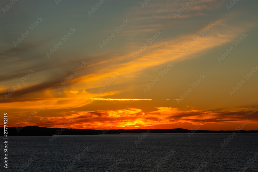 Beautiful sunset with clouds over lake Nasijarvi in Tampere, Finland